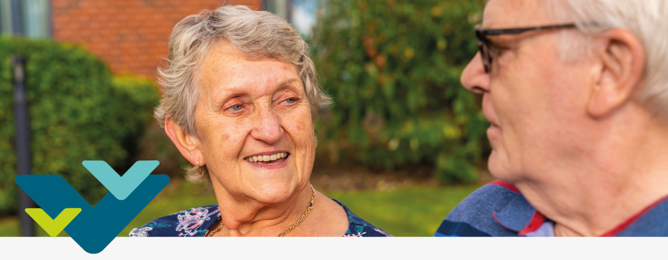 Two Sanctuary residents sat in a garden talking together