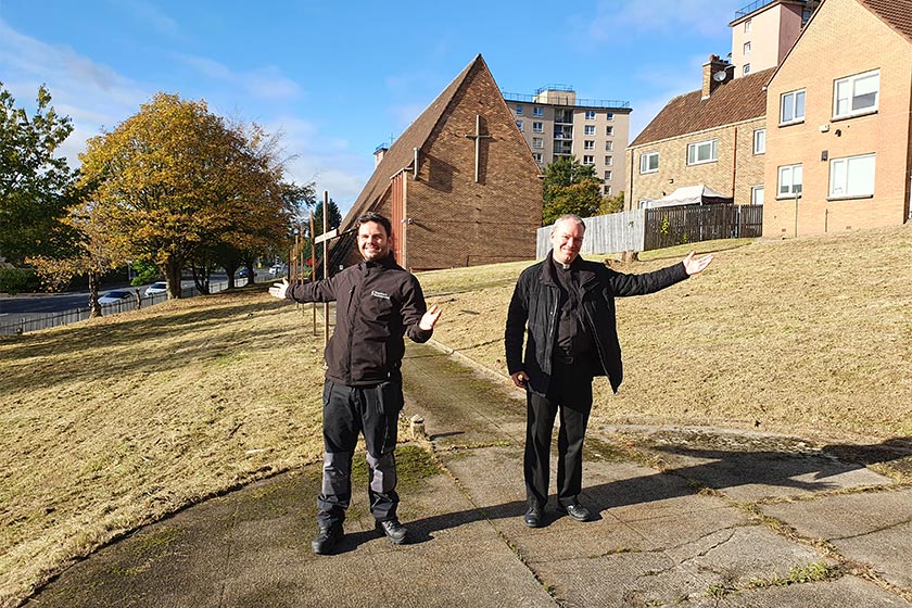 Estate Staff Supervisor Chris Wilson and Friar Gerald Byrne standing in the church grounds