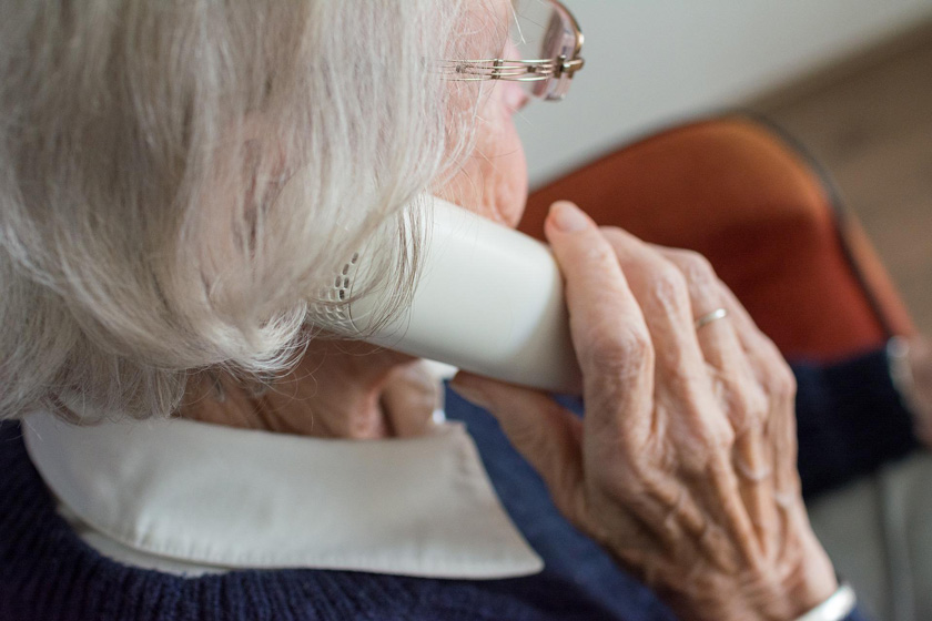 An elderly lady on the phone