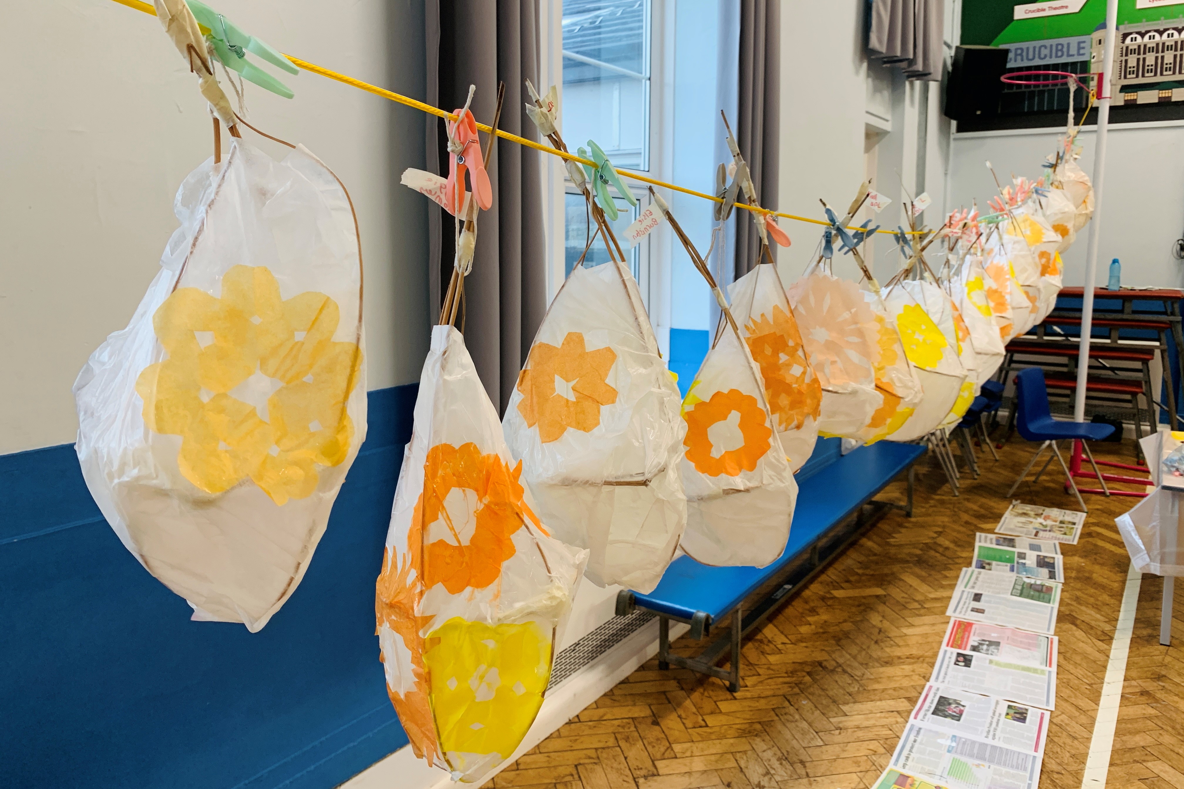 Handmade lanterns hang in a row