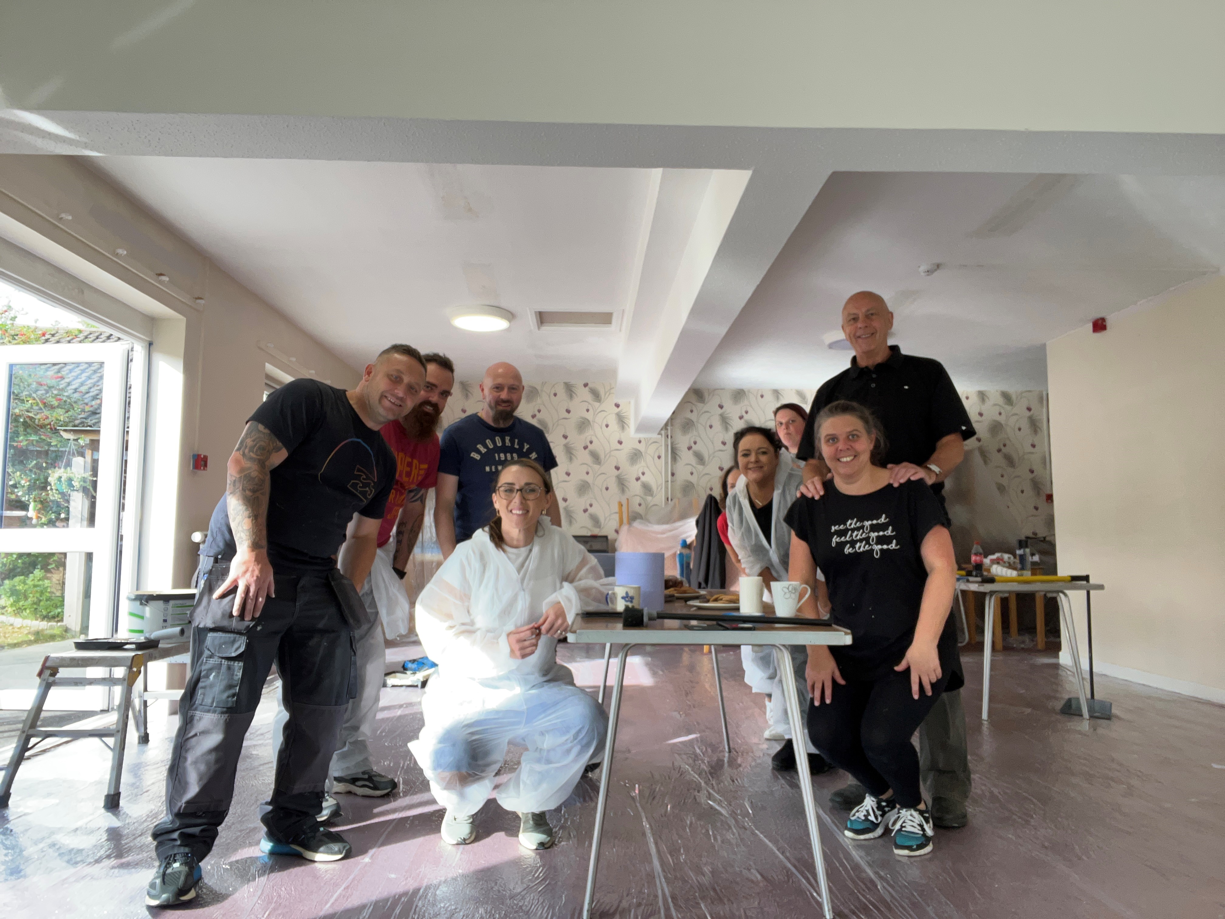 Sanctuary staff stand in a room that has recently been redecorated