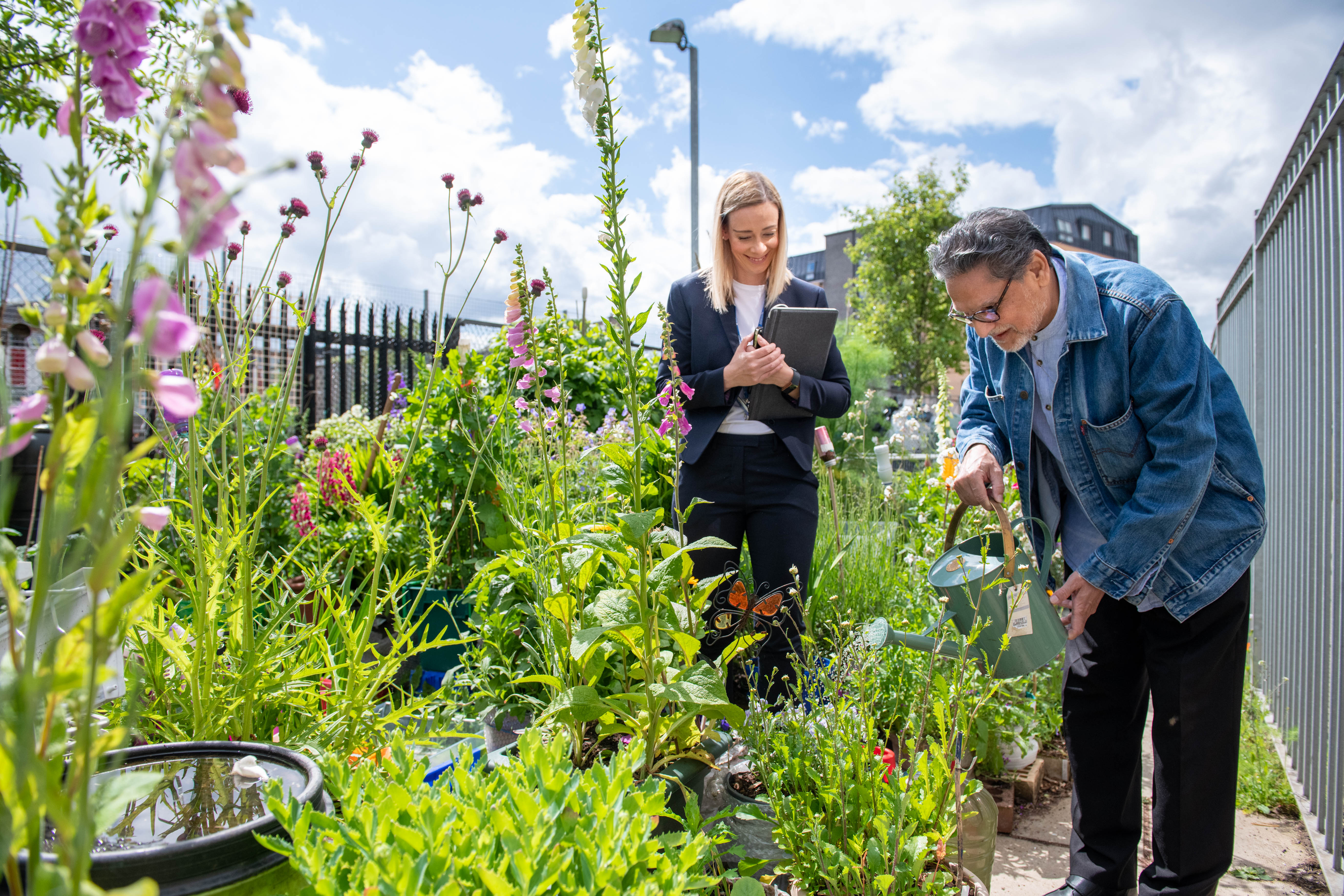 Housing Officer Janine Pulling with resident Rana Jude at Anderston allotments