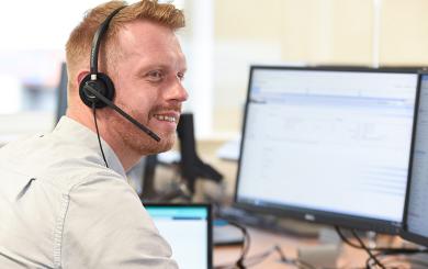 Sanctuary staff member wearing a headset to answer calls