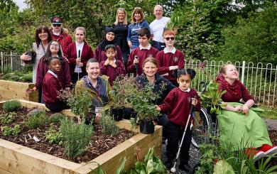 A group picture of staff and students from Priestly Smith Specialist School