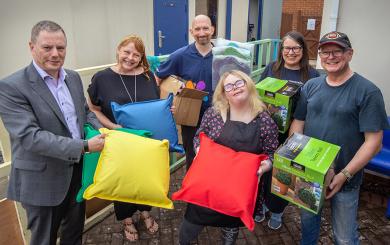 Craig Moule joined Paul Hinett and the volunteers to make a surprise gift of garden decorations and accessories.