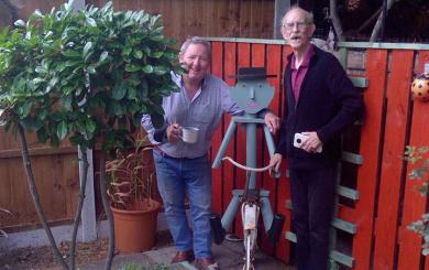 Two residents stood next to their garden feature