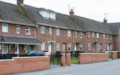 Terrace street of worn brick built properties