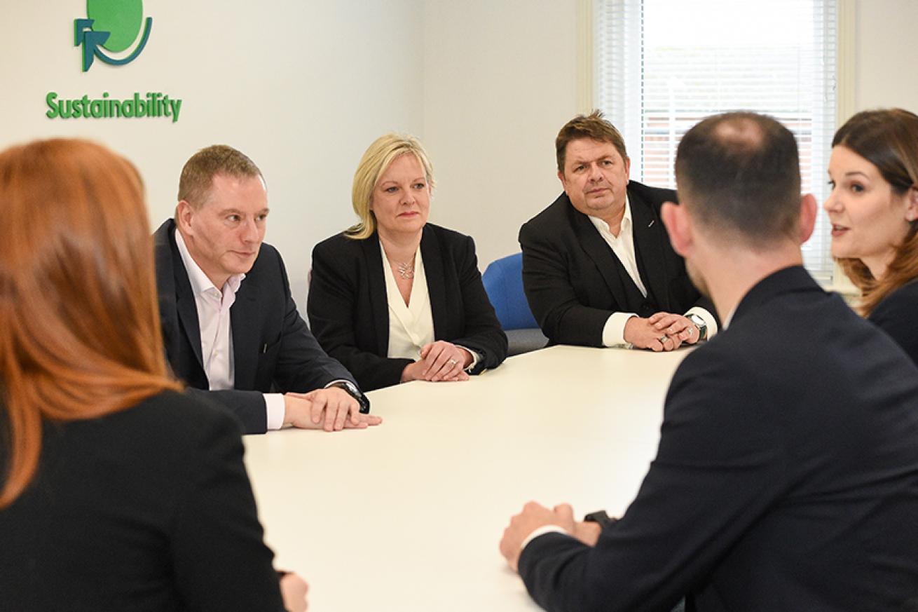 Members of Sanctuary's Executive board sitting around a wooden table