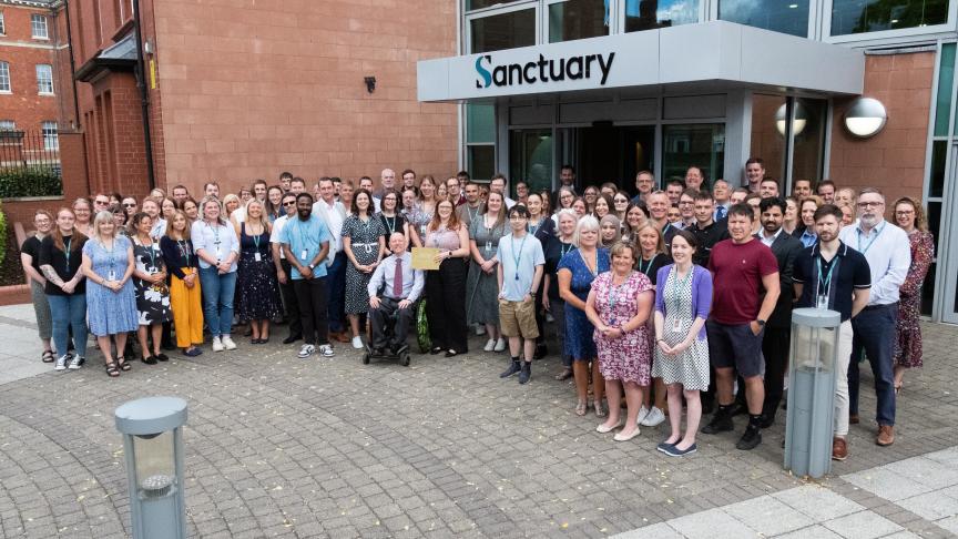 A large group of Sanctuary employees stood outside the head office in Worcester