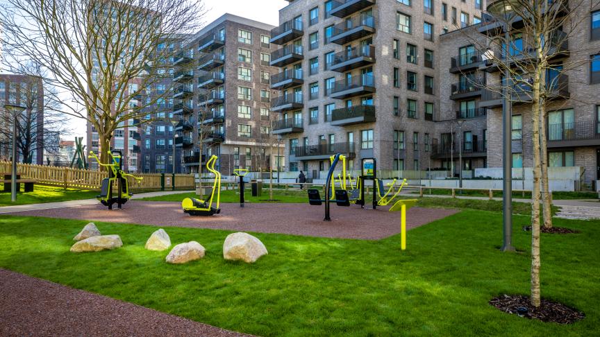 High rise buildings with an outdoor gym park in the forefront