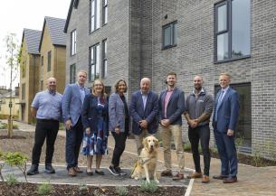 Mark Rowe - Assistant Site Manager, Lovell; Ross Field - Regional Managing Director, Lovell; Cllr. Hazel Foster; Claire Newcombe – Development Manager, Sanctuary; Steve Darling MP (with Jenny the dog); Matt Shaw - Operations Manager, Lovell; Sam Clarke - Site Manager, Lovell; Chris Cole - Development Director - England, Sanctuary standing in front needed new affordable homes for local people in Torquay.