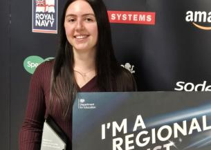 Regional finalist Katie at the awards ceremony holding her award